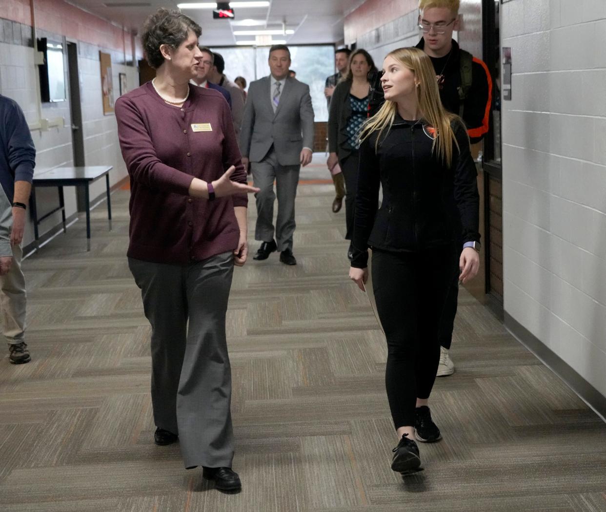 Wisconsin superintendent of the Department of Public Instruction, Jill Underly, walks with Abigail Bigler, a senior at Grafton High School during Underly's recent visit to the school.