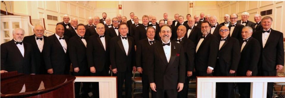 John Palatucci, center, with Ridgewood's Orpheus Club Men's Chorus in 2019, before COVID forced the group to perform remotely.