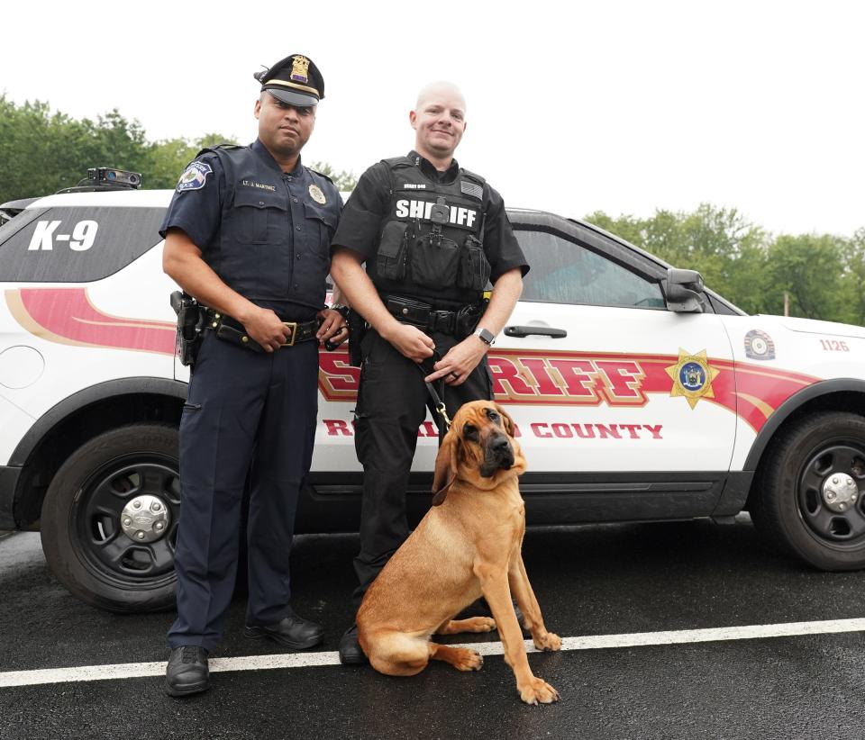 Suffern Police Lt. Jose Martinez, left, with Rockland County Deputy Sheriff Brian Neary and K-9 Galli photographed at the Rockland County Sheriff's office in New City on Tuesday, August 15, 2023.