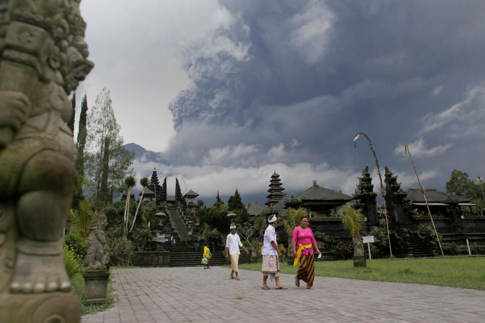 Balinese Hindus leave&nbsp;Besakih Temple in Karangasem as Mount Agung volcano erupted on&nbsp;Saturday.