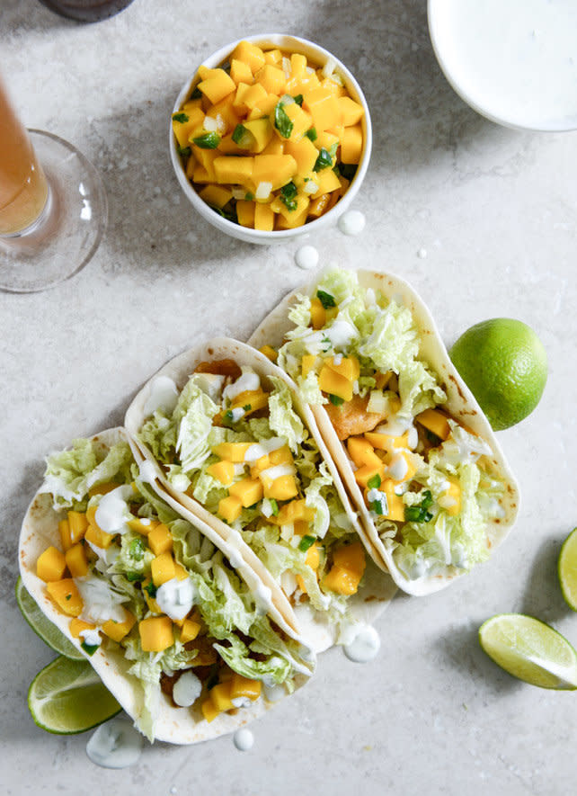 <strong>Get the<a href="http://www.howsweeteats.com/2014/03/beer-battered-fish-tacos-with-margarita-mango-salsa-and-jalapeno-crema/" target="_blank"> Beer Battered Fish Tacos With Margarita Mango Salsa And Jalapeño Crema</a> recipe from How Sweet It Is</strong>