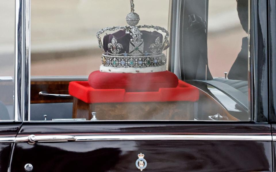 The Imperial State Crown is driven from Buckingham Palace to the Houses of Parliament - AFP