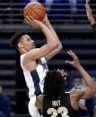 Penn State's Myreon Jones shoots for a basket over Purdue defenders during an NCAA college basketball game Friday, Feb. 26, 2021, in State College, Pa. (Abby Drey/Centre Daily Times via AP)