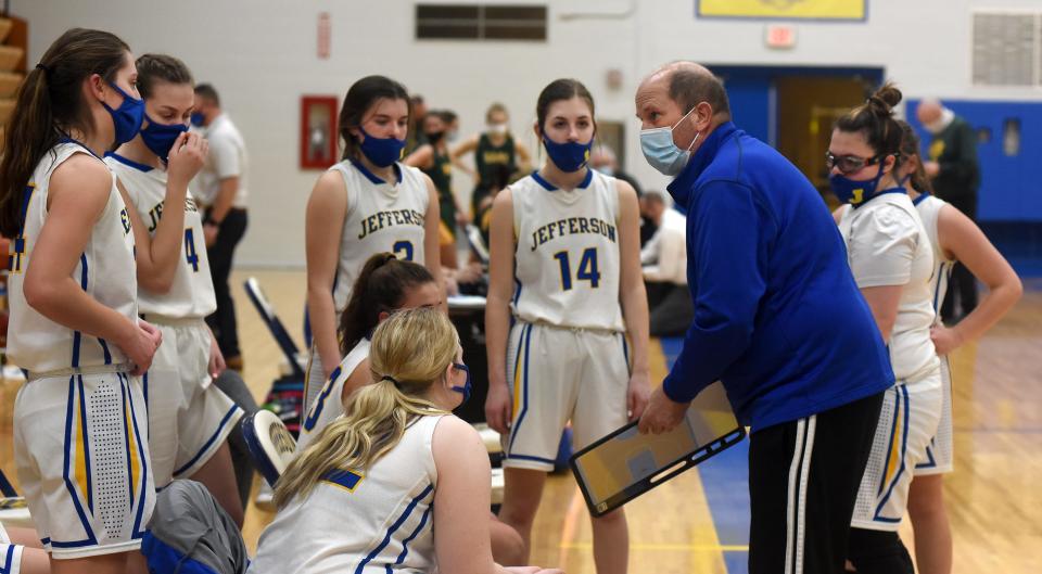 Jefferson head coach Bryan Parran talks with his team during a game last season.