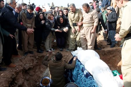 Mourners attend a funeral of victims who were killed in a bomb attack at the offices of the Democratic Party of Iranian Kurdistan (PDKI) in Koy Sanjak, east of Erbil, Iraq, December 21, 2016. REUTERS/Azad Lashkari