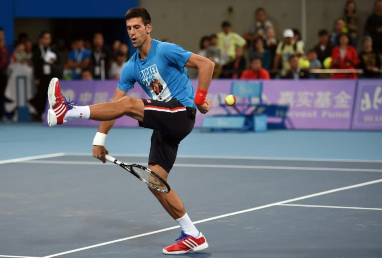 Novak Djokovic of Serbia performs during a charity event at the China Open tennis tournament in Beijing on October 3, 2015