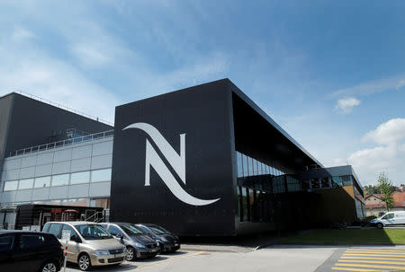 FILE PHOTO: A Nespresso logo is pictured on a coffee factory at Nestle in Orbe, Switzerland May 31, 2018. Picture taken May 31, 2018. REUTERS/Denis Balibouse