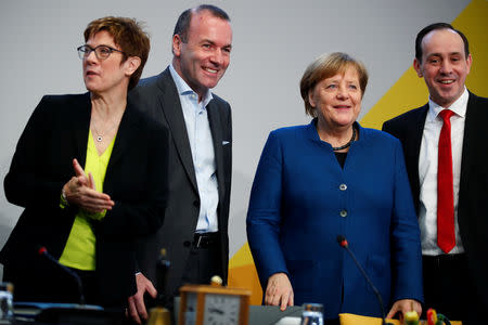 CDU party leader Annegret Kramp-Karrenbauer, Manfred Weber, member of the Christian Social Union party, CSU, and top candidate of the European People's Party (EPP) for the European elections, German Chancellor Angela Merkel and leader of the CDU state group of Brandenburg, Ingo Senftleben attend a strategy meeting of Germany's governing Christian Democratic Union (CDU) party in Potsdam, Germany, January 14, 2019. REUTERS/Axel Schmidt