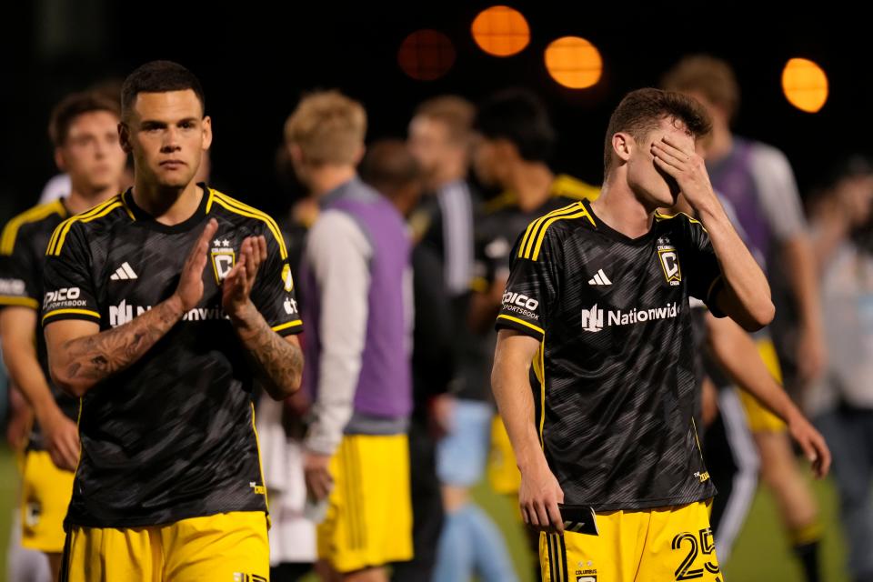 Forward Christian Ramirez applauds the traveling Crew supporters beside midfielder Sean Zawadzki following Wednesday's loss to the Pittsburgh Riverhounds.