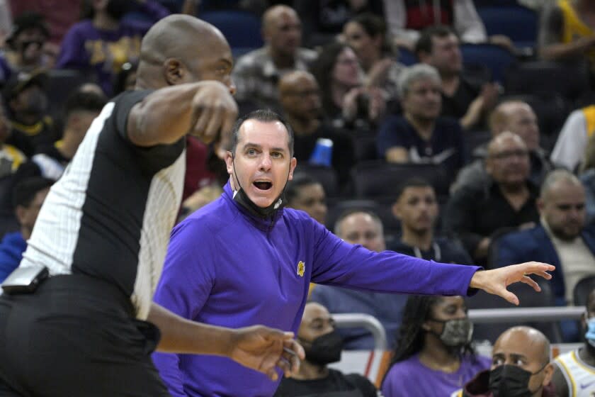 Los Angeles Lakers head coach Frank Vogel, right, argues after a point with official Courtney Kirkland during the first half of an NBA basketball game against the Orlando Magic, Friday, Jan. 21, 2022, in Orlando, Fla. (AP Photo/Phelan M. Ebenhack)