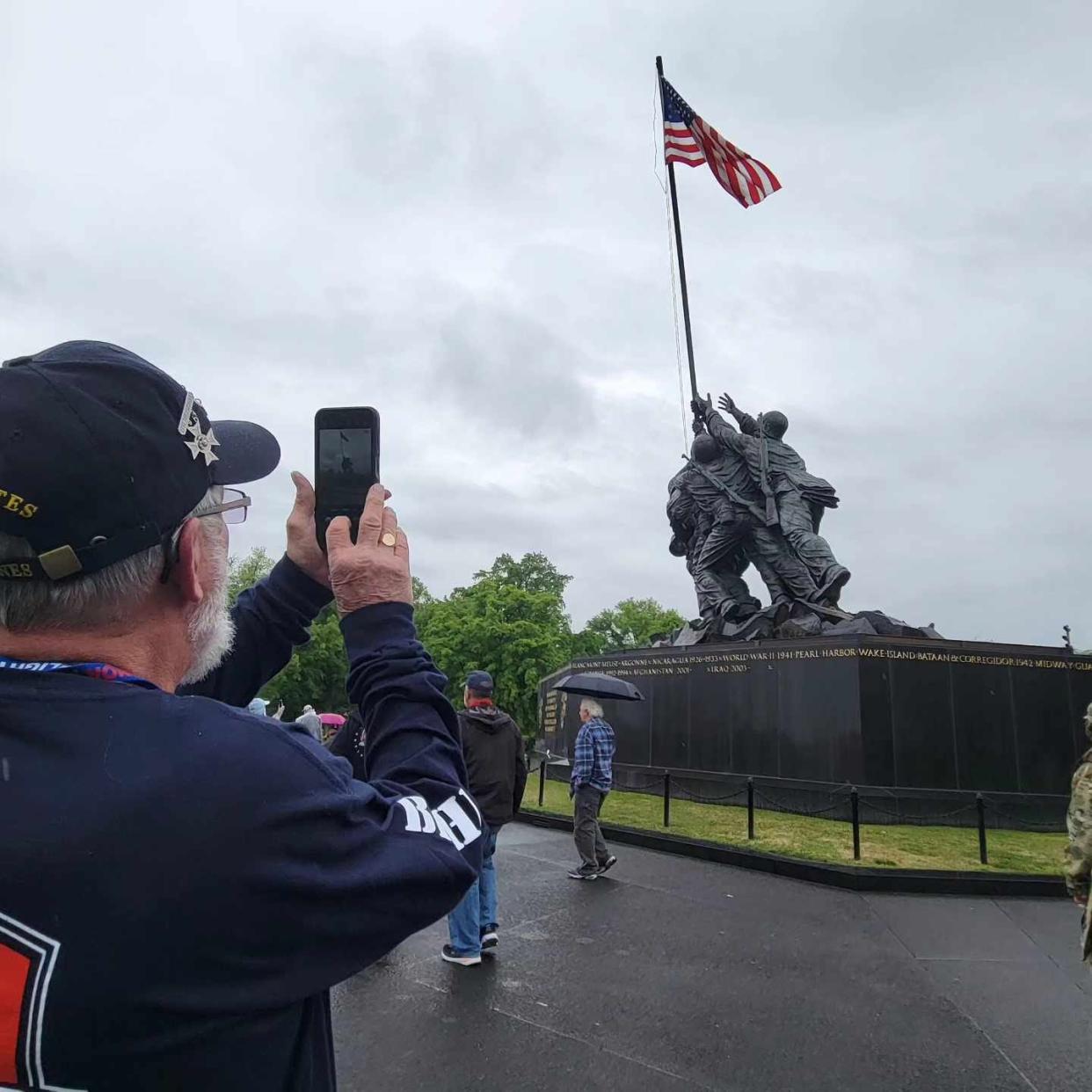 Vietnam veteran Ronnie Robinson takes a photo at the Iwo Jima Marines Memorial on April 27 in Washington, D.C.