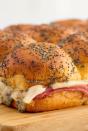 <p>The homemade poppyseed dressing makes these sliders EXTRA special. We like using yellow mustard for it's bright, acidic flavour, but dijon or whole grain mustard would be just as delicious. </p><p>Get the <a href="https://www.delish.com/uk/cooking/recipes/a32431147/ham-cheese-sliders-recipe/" rel="nofollow noopener" target="_blank" data-ylk="slk:Ham & Cheese Sliders;elm:context_link;itc:0;sec:content-canvas" class="link ">Ham & Cheese Sliders</a> recipe.</p>