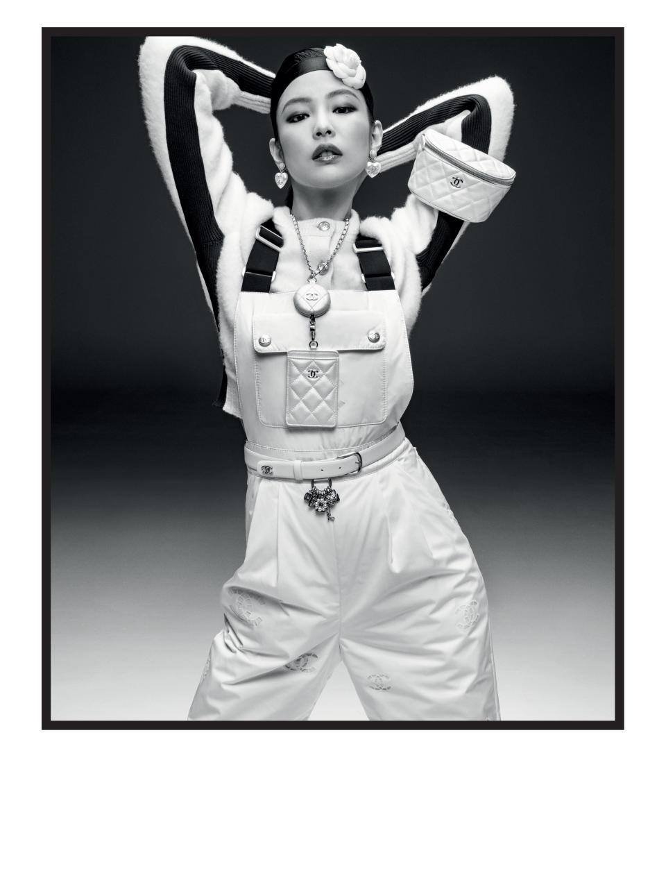 Accessories include bags strapped to the arm. - Credit: Inez van Lamsweerde and Vinoodh Matadin