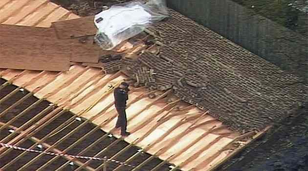 Police examine a brick wall that collapsed killing a man in Brighton East, Melbourne. Photo: ABC