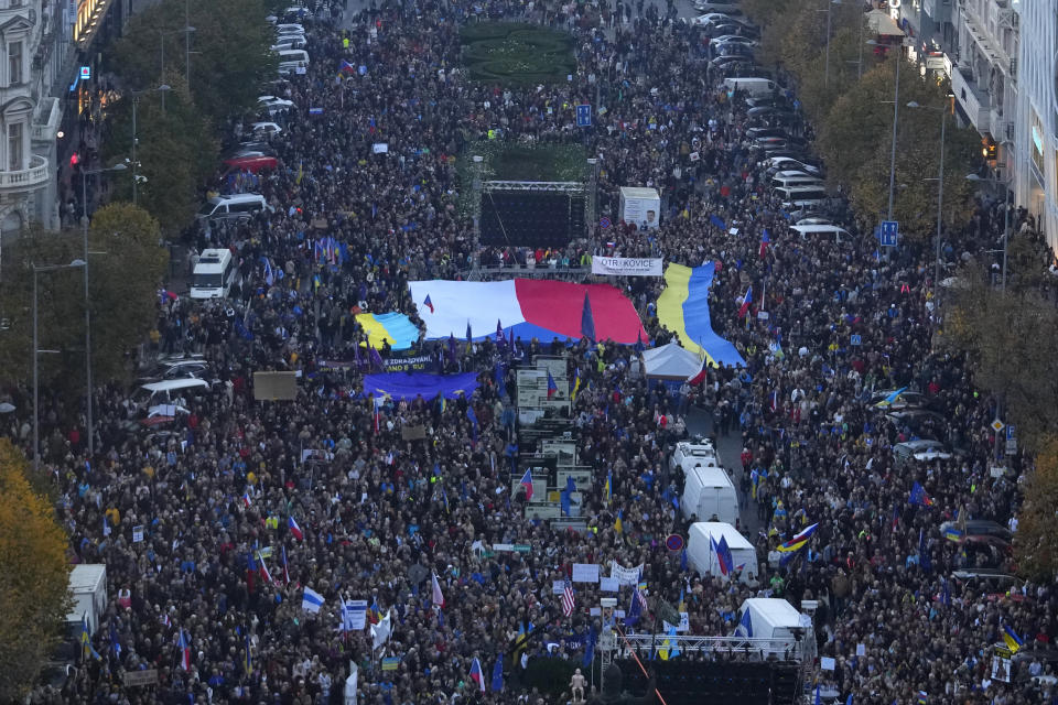 Tens of thousands of people gathers for an anti-war protest in Prague, Czech Republic, Sunday, Oct. 30, 2022. (AP Photo/Petr David Josek)