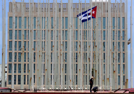 Men work in front of the U.S. embassy in Havana, Cuba, July 20, 2016. REUTERS/Enrique de la Osa