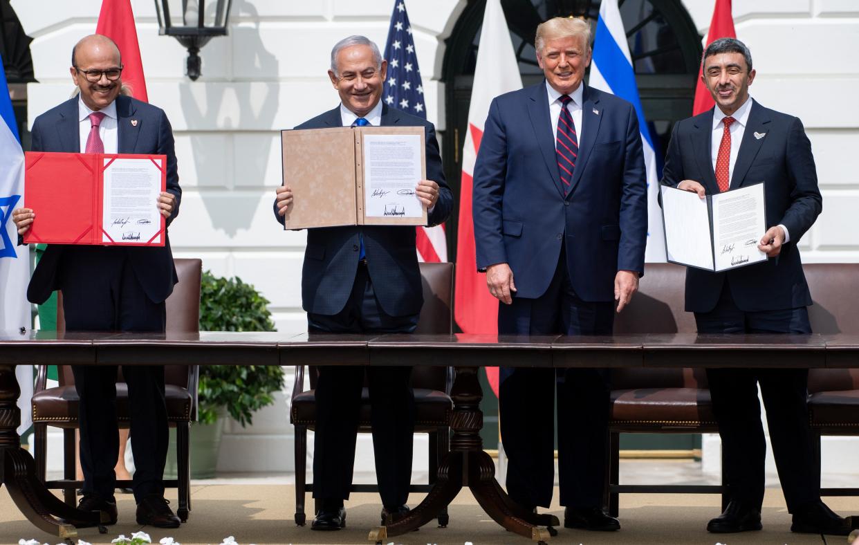 From left to right, Bahrain Foreign Minister Abdullatif al-Zayani, Israeli Prime Minister Benjamin Netanyahu, U.S. President Donald Trump and UAE Foreign Minister Abdullah bin Zayed Al Nahyan are pictured at the White House on Sept. 15, 2020, after signing the Abraham Accords, in which Bahrain and the United Arab Emirates recognized Israel. (Photo: SAUL LOEB via Getty Images)