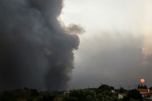 Smoke rose from a wildfire close to Monchique in the Algarve, southern Portugal, where more than a 1,000 firefighters are battling the blaze