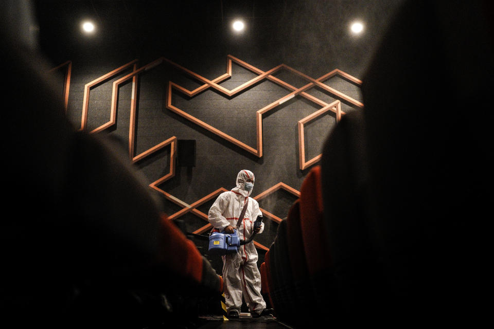 WUHAN, CHINA - JULY 20: (CHINA OUT)The employees wear the protective clothing disinfection in a cinema at Wuhan on July 20, 2020 in Wuhan ,Hubei Province,China.Taking various measures against COVID-19, cinemas in the city reopened in an orderly manner on Monday. The China Film Administration, in a circular last week, allowed cinemas in low-risk areas to resume operation with effective epidemic prevention measures in place. (Photo by Getty Images)