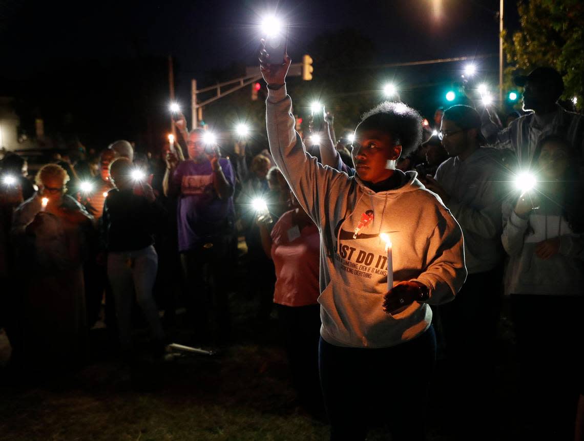 Family, friends and community members attend a vigil for Atatiana Jefferson near her home in Fort Worth after her death.