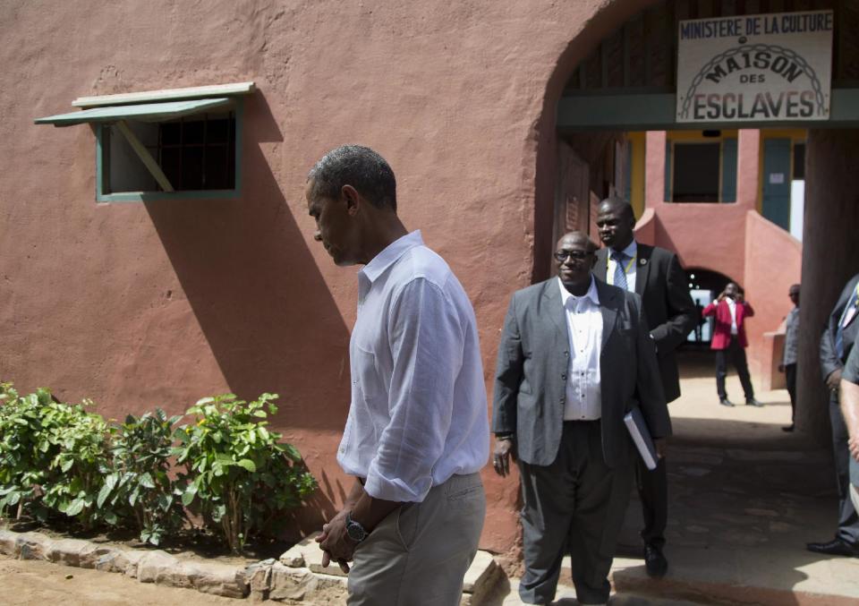 President Barack Obama leaves after talking about his tour of Goree Island, Thursday, June 27, 2013, in Goree Island, Senegal. Goree Island is the site of the former slave house and embarkation point built by the Dutch in 1776, from which slaves were brought to the Americas. (AP Photo/Evan Vucci)