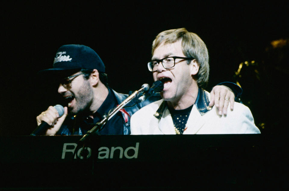 NEW YORK, NY - OCTOBER 11:  George Michael and Elton John perform onstage during The Concert Benefiting The Elizabeth Taylor AIDS Foundation at Madison Square Garden on October 11, 1992 in New York City.  (Photo by Kevin Mazur/WireImage)