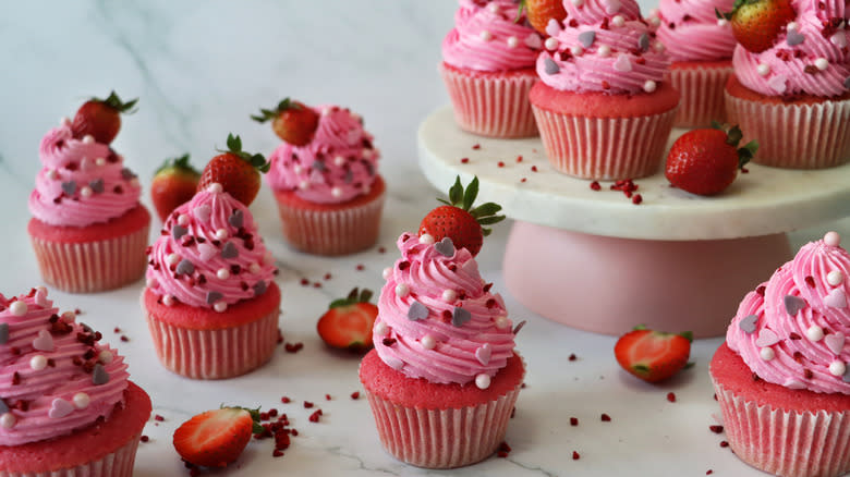 Strawberry cupcakes with heart and pearl decorations