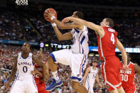 NEW ORLEANS, LA - MARCH 31: Travis Releford #24 of the Kansas Jayhawks goes up for a shot in front of Aaron Craft #4 of the Ohio State Buckeyes in the second half during the National Semifinal game of the 2012 NCAA Division I Men's Basketball Championship at the Mercedes-Benz Superdome on March 31, 2012 in New Orleans, Louisiana. (Photo by Jeff Gross/Getty Images)