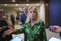 Rep. Debbie Dingell, D-Mich., a staunch defender of the American automobile industry, pauses for reporters after a meeting of the House Democratic Caucus and Biden administration officials to discuss progress on an infrastructure bill, at the Capitol in Washington, Tuesday, June 15, 2021. (AP Photo/J. Scott Applewhite)