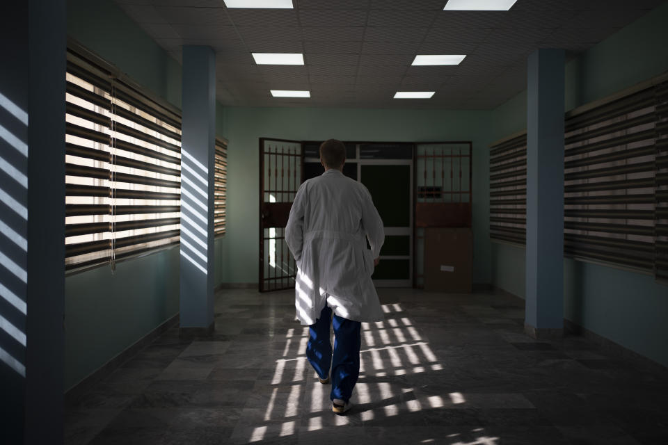 Dr. Vitaly Dedovich, of the Novick Cardiac Alliance medical team walks to the operating room at the Tajoura National Heart Center in Tripoli, Libya, on Feb. 24, 2020. Novick’s group not only drops in a few times a year, but also trains Libyan doctors and nurses to build up the country’s critical health care system. (AP Photo/Felipe Dana)