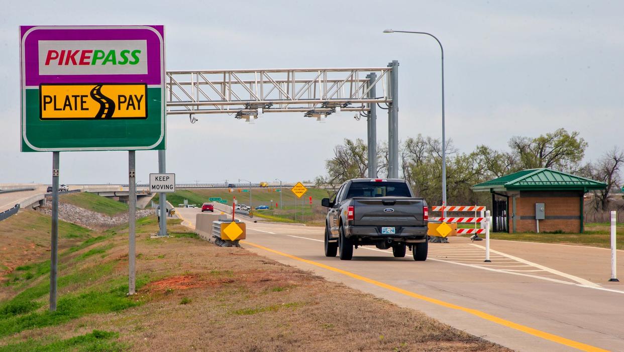 Traffic passes through the toll gate April 4 on the Kilpatrick Turnpike in Oklahoma City.