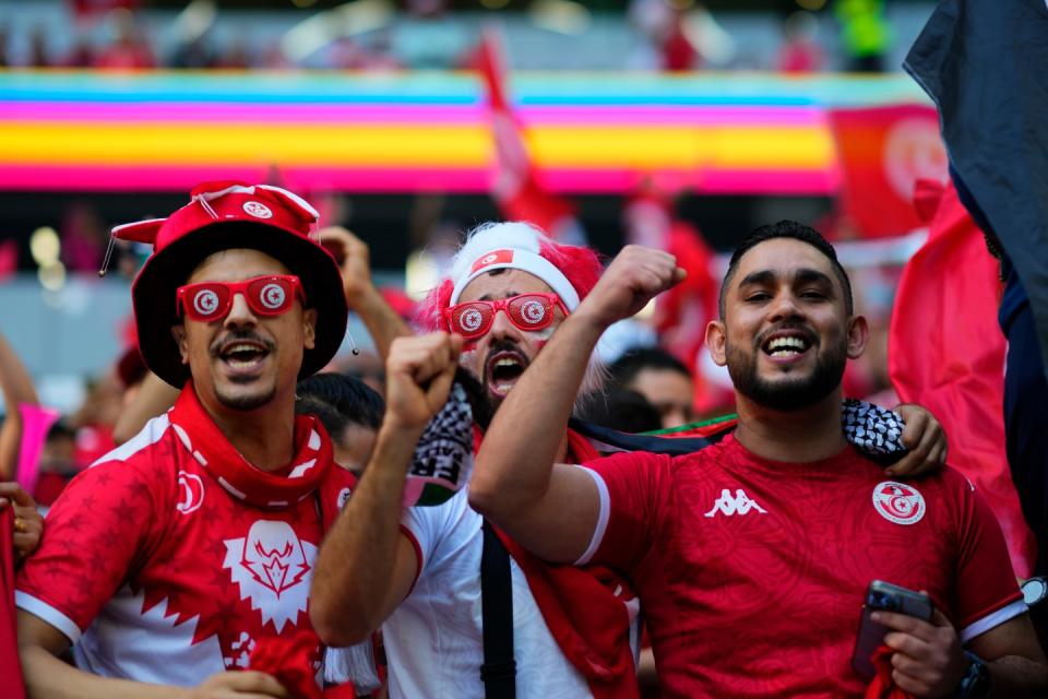 Tunisian fans cheer before the start of the World Cup group D football match between Denmark and Tunisia, at the Education City Stadium in Al Rayyan , Qatar, Tuesday, Nov. 22, 2022. (AP Photo/Petr David Josek)