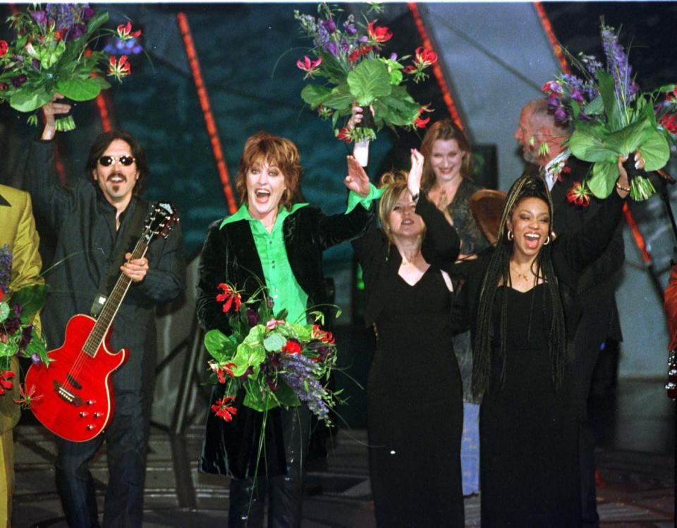 Katrina  Leskanavich  with her backing group the Waves  celebrates her victory after winning  the Eurovision Song Contest at the Point Theatre in Dublin, Saturday May 3 1997. Pic John Giles.PA