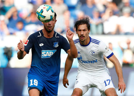 Soccer Football - Bundesliga - TSG 1899 Hoffenheim vs Schalke 04 - Rhein-Neckar-Arena, Hoffenheim, Germany - September 23, 2017 Hoffenheim’s Mark Uth in action with Schalke’s Benjamin Stambouli REUTERS/Michaela Rehle