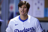 Los Angeles Dodgers designated hitter Shohei Ohtani stands in the dugout during the fifth inning of a baseball game against the Washington Nationals, Wednesday, April 17, 2024, in Los Angeles. (AP Photo/Ryan Sun)