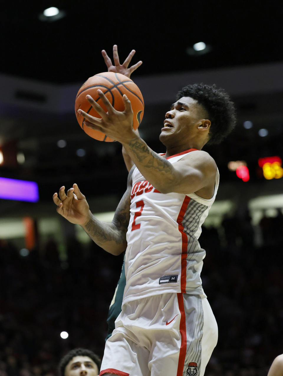 New Mexico guard Donovan Dent drives to the basket for the game-winning basket with seconds remaining against Colorado State in an NCAA college basketball game Wednesday, Feb. 21, 2024, in Albuquerque, N.M. (AP Photo/Eric Draper)