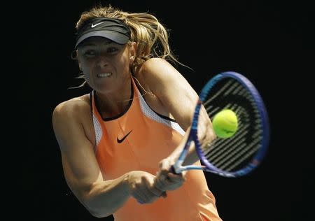 Russia's Maria Sharapova hits a shot during her quarter-final match against Serena Williams of the U.S. at the Australian Open tennis tournament at Melbourne Park, Australia, January 26, 2016. REUTERS/Issei Kato