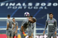 Atletico Madrid's goalkeeper Jan Oblak plays with a ball during a training session at the Jose Alvalade stadium in Lisbon, Wednesday Aug. 12, 2020. Atletico Madrid will play Leipzig in a Champions League quarterfinals soccer match on Thursday. (Miguel A. Lopes/Pool via AP)