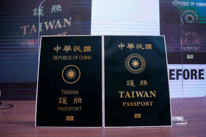 Paper cut outs of the old and new Taiwan passport are displayed in Taipei