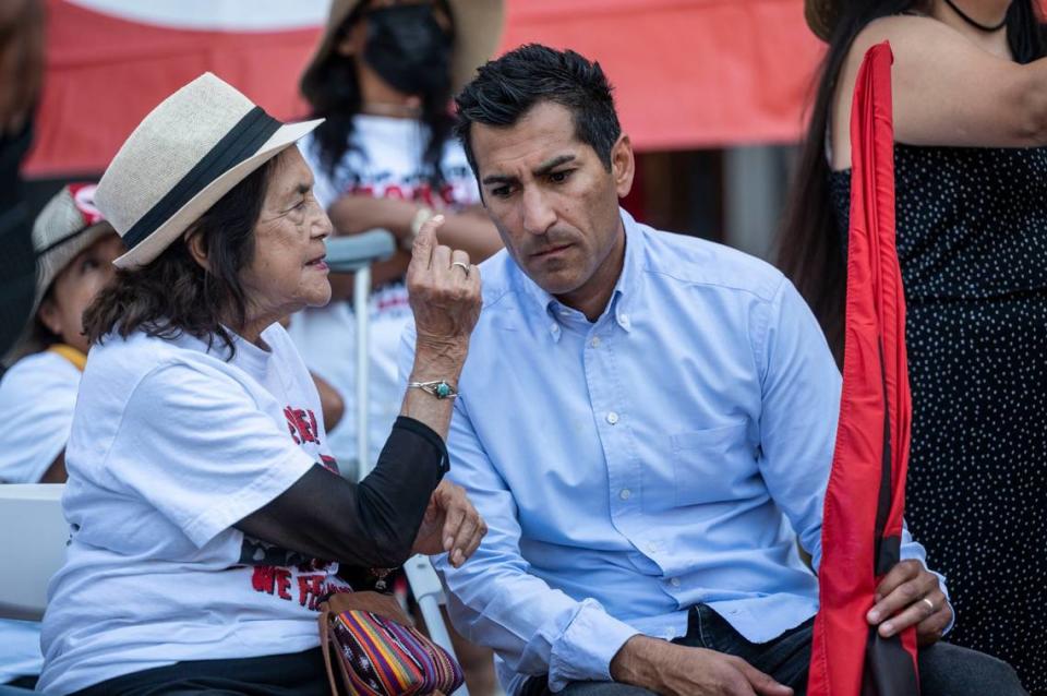 United Farm Workers co-founder Dolores Huerta talks with Assemblyman Robert Rivas, D-Salinas on the west steps of the Capitol last August at the end of a march to persuade Gov. Gavin Newsom to sign Assembly Bill 2183 that would allow farmworkers to seek a vote from home ballot to unionize. Hector Amezcua/hamezcua@sacbee.com