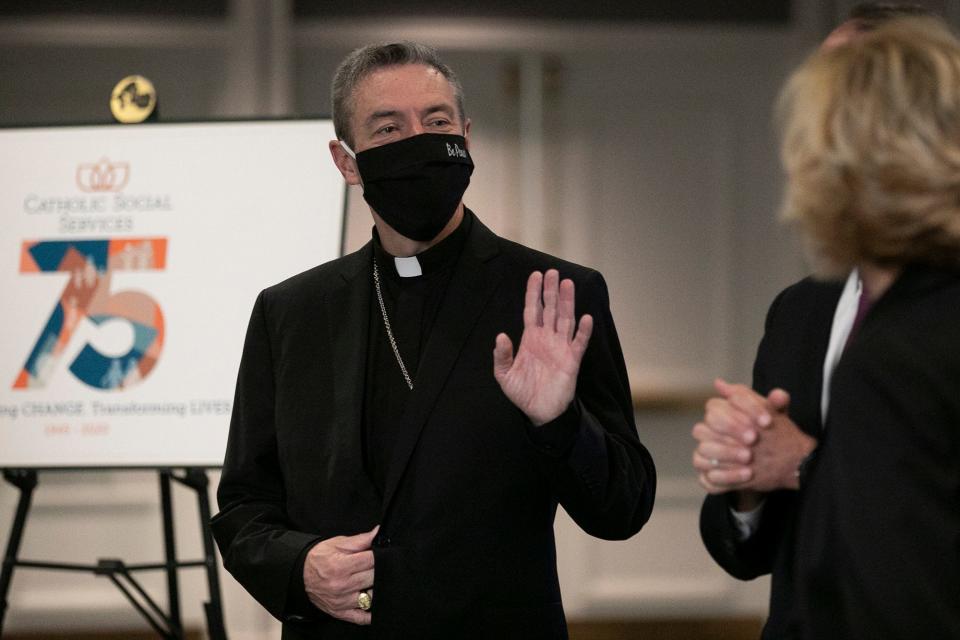 Columbus Catholic Bishop Robert Brennan greets people as they arrive for the annual Catholic Social Services' Breakfast with the Bishop, Friday, September 10, 2021.