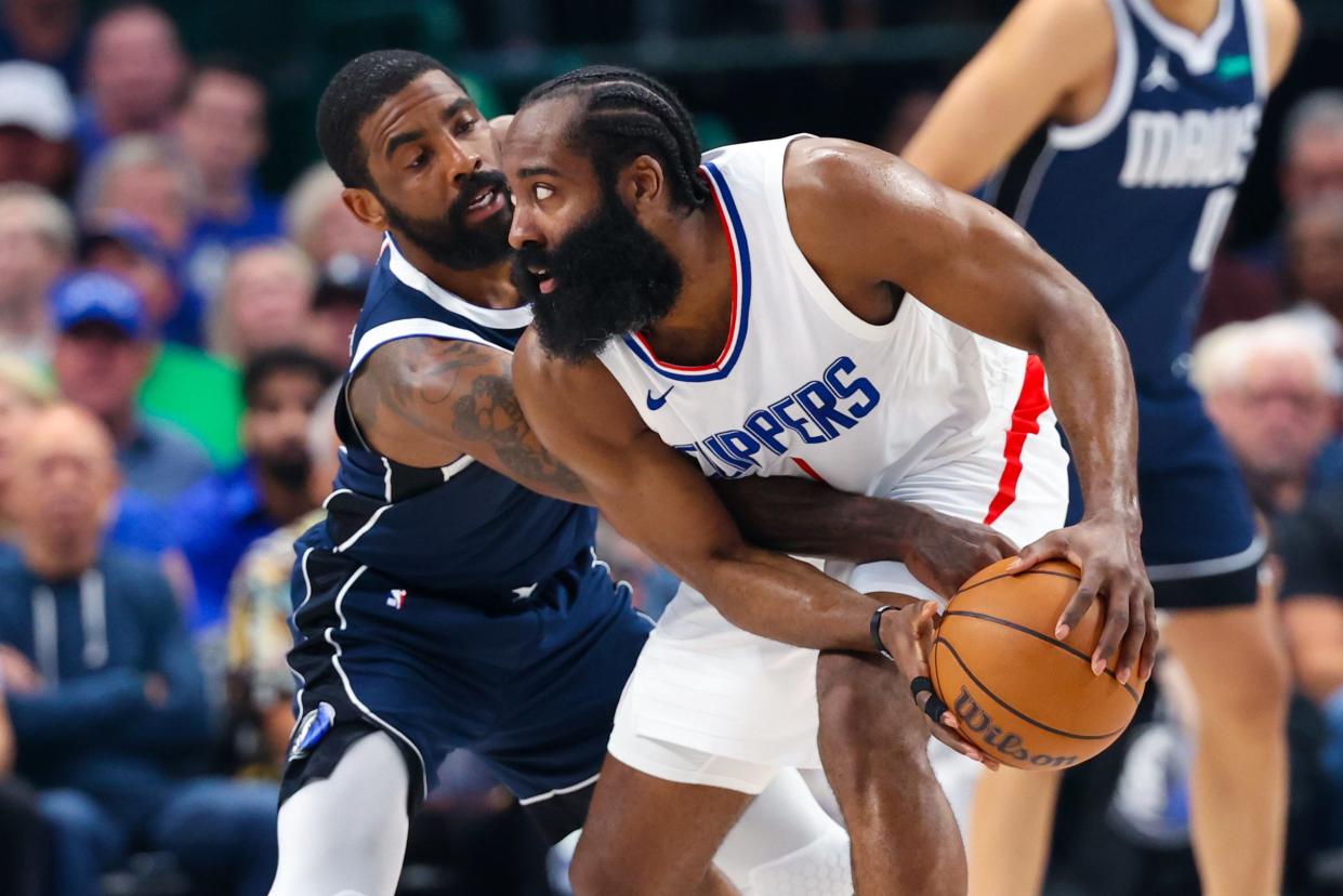 LA Clippers guard James Harden (1) controls the ball as Dallas Mavericks guard Kyrie Irving (11) defends during the Game 4 of their first-round playoff series.