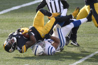 Pittsburgh Steelers cornerback Mike Hilton (28) tumbles over Indianapolis Colts running back Jonathan Taylor (28) as he recovers a fumble during the first half of an NFL football game, Sunday, Dec. 27, 2020, in Pittsburgh. (AP Photo/Don Wright)