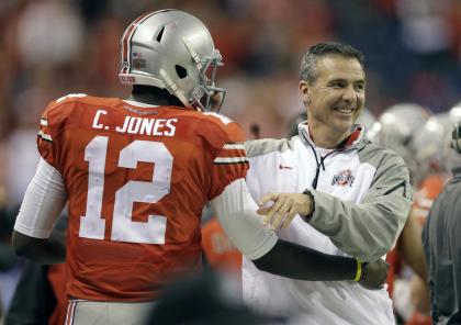 Urban Meyer (R) smiles after QB Cardale Jones (L) led the Buckeyes to the national title. (AP)