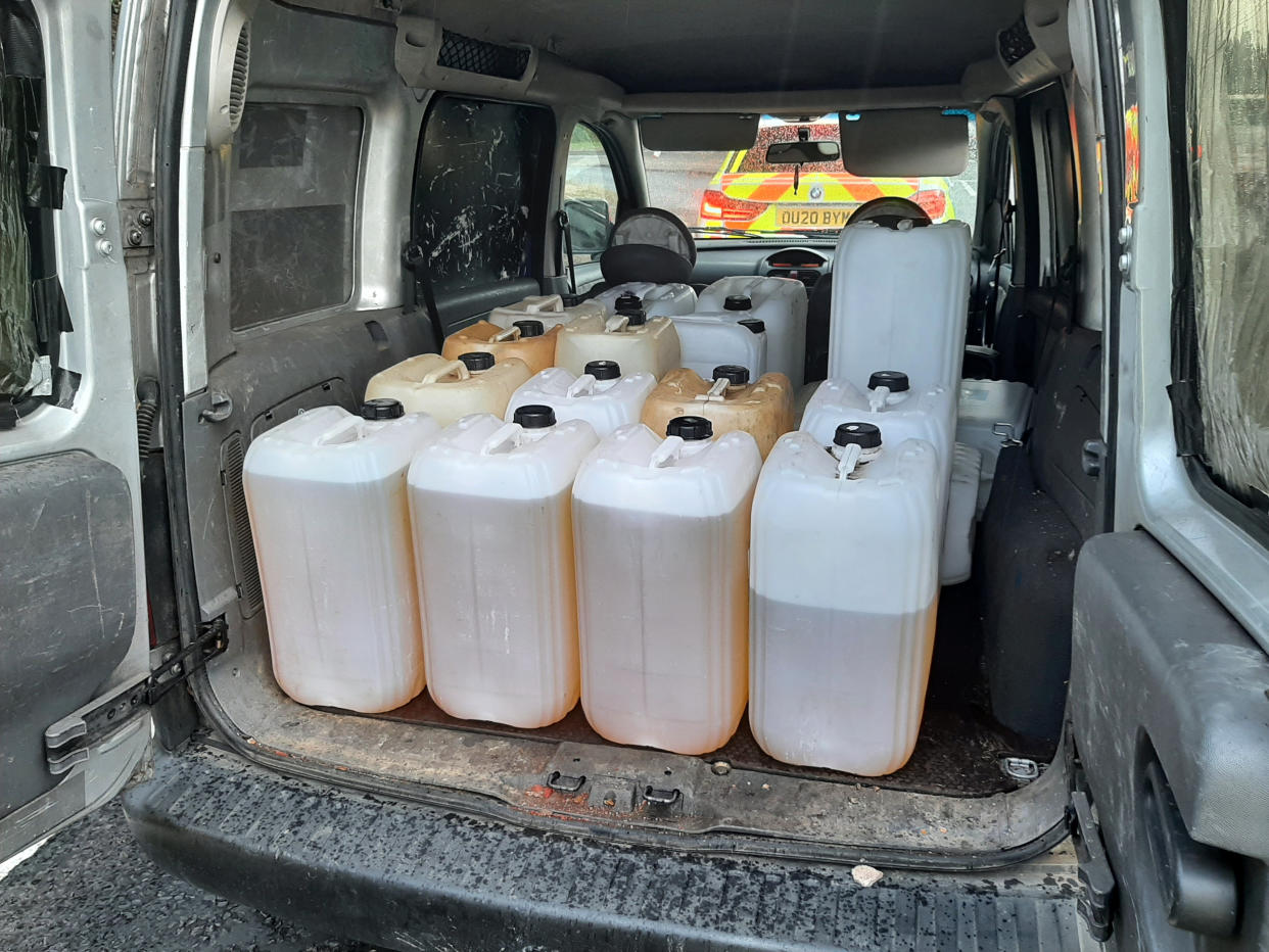 Police discover containers filled with suspected stolen fuel in van on the A10 at Cheshunt. (SWNS)