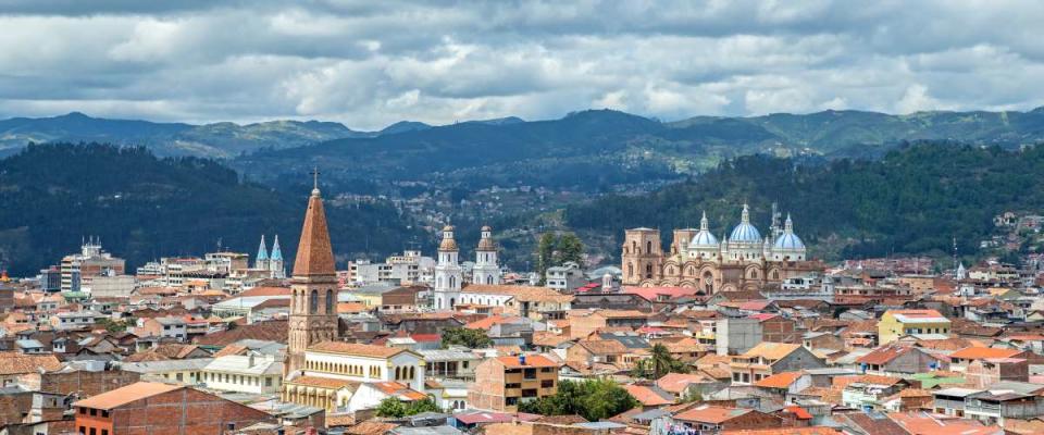 View of the city of Cuenca, Ecuador, with it's many churches, on a cloudy day.