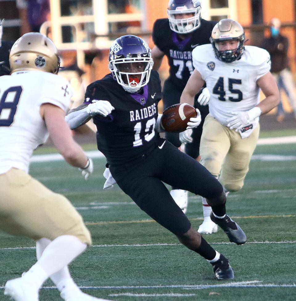 Mount Union wide receiver Jaden Manley gains extra yards after a catch during the Purple Raiders' game against John Carroll Friday, March 19, 2021 at Mount Union Stadium.