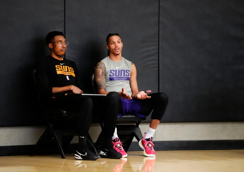 Phoenix Suns guard Damion Lee (right) talks to assistant coach Patrick Mutombo on May 4, 2023, as the team prepares for Game 3 of the Western Conference Semifinals against the Denver Nuggets.