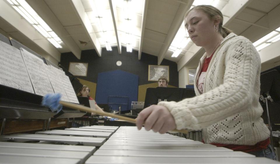 Brittany Tyler, 18, plays the xylophone during practice with the Lancaster High School Percussion Ensemble, inside the high school, in Lancaster, Ohio, on Monday, April 12, 2004. The group will travel to San Francisco for a concert.