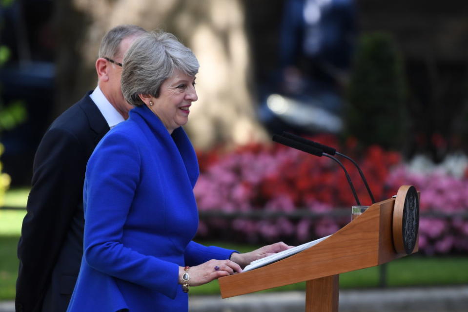 Former British Prime Minister Theresa May makes her outgoing statement alongside husband Philip May at Downing Street. [Photo: Getty]
